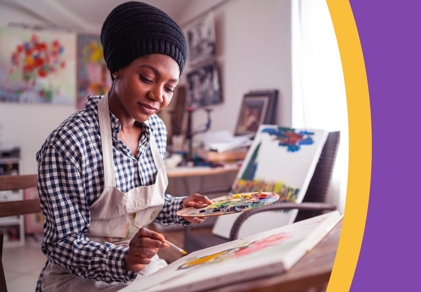 Wellstar MCG Health to Exhibit Local Black Artists Artist holding palette and painting
