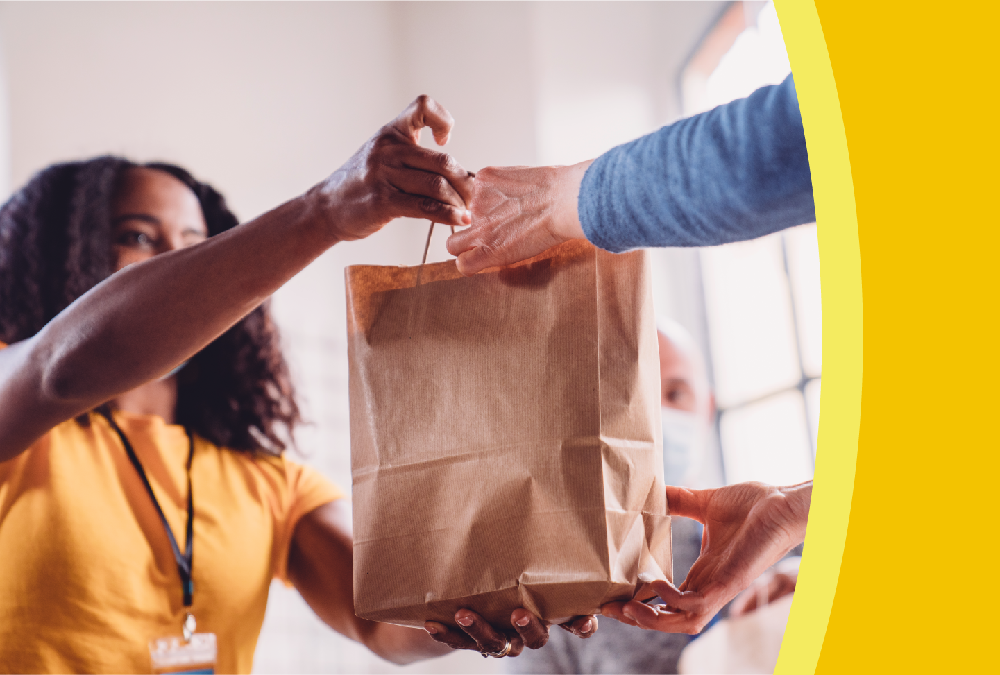 Person receiving bag of groceries