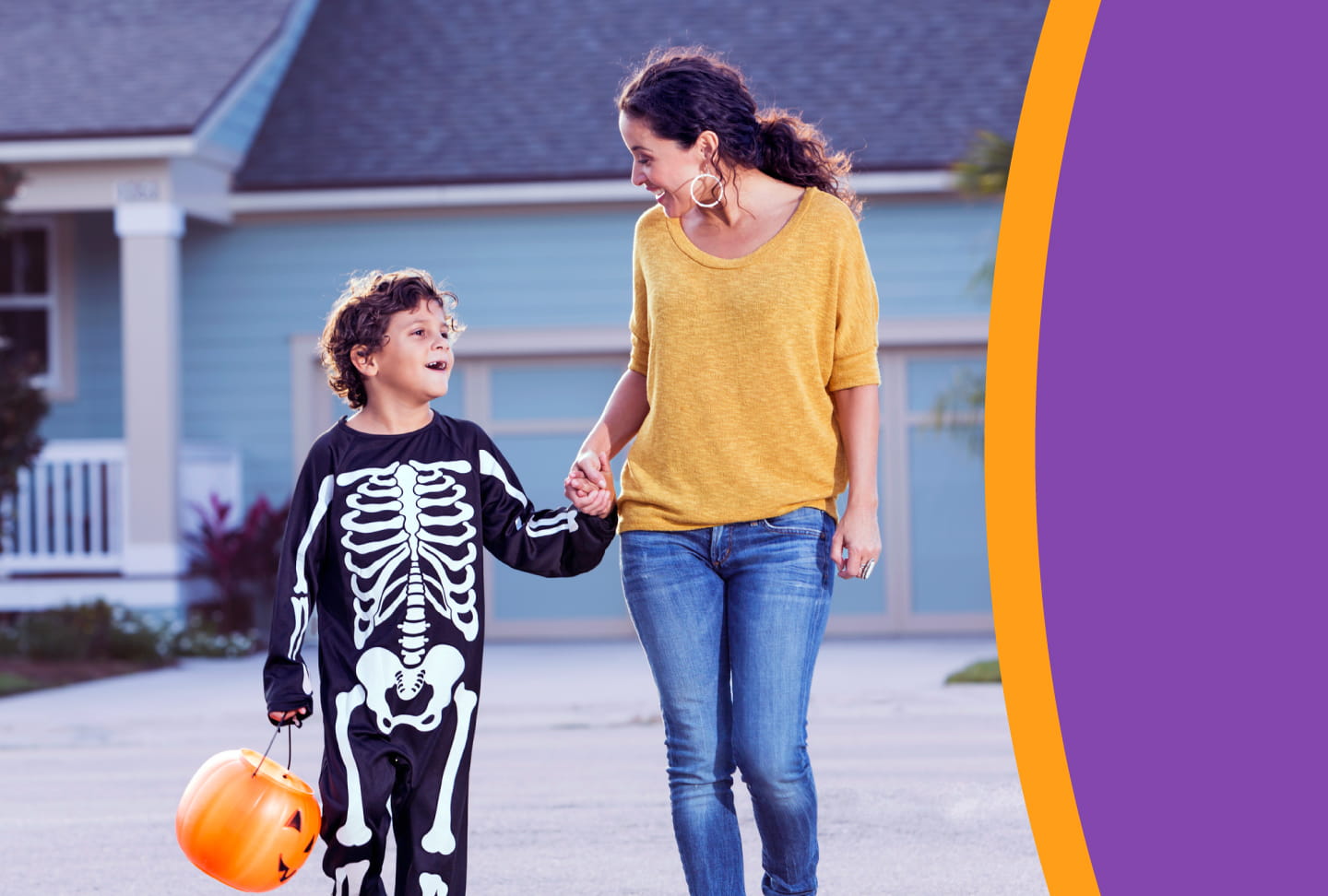 Child in skeleton costume walking with parent