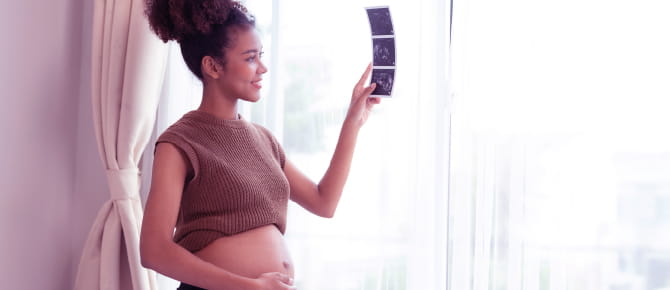 Smiling woman who is pregnant