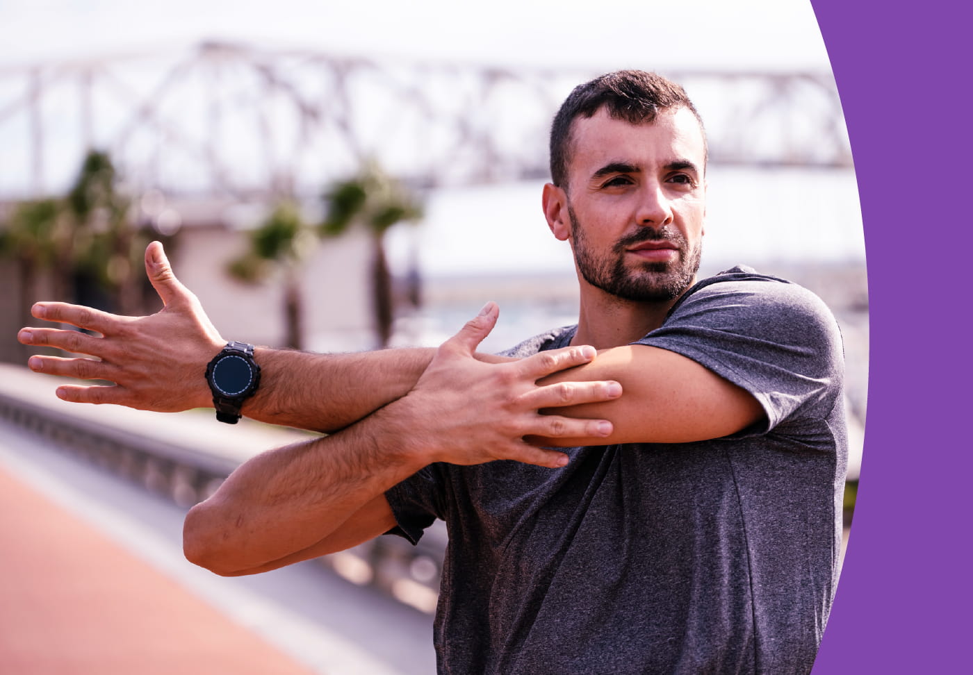 Man exercising his upper body by stretching his arm