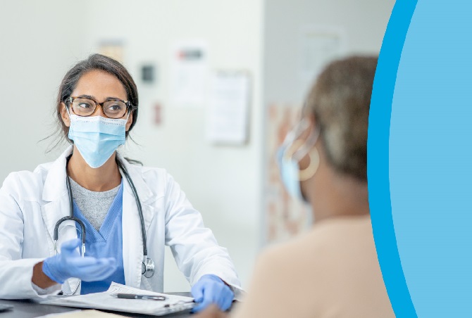 Physician talking with patient.
