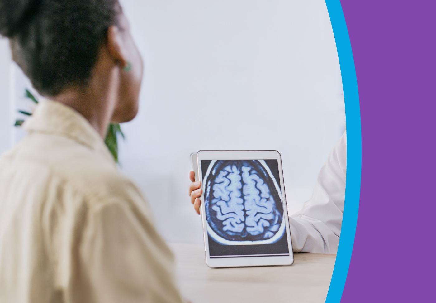 Epilepsy Expert Explains Diagnosis and Treatment A healthcare provider shows a brain scan to their patient