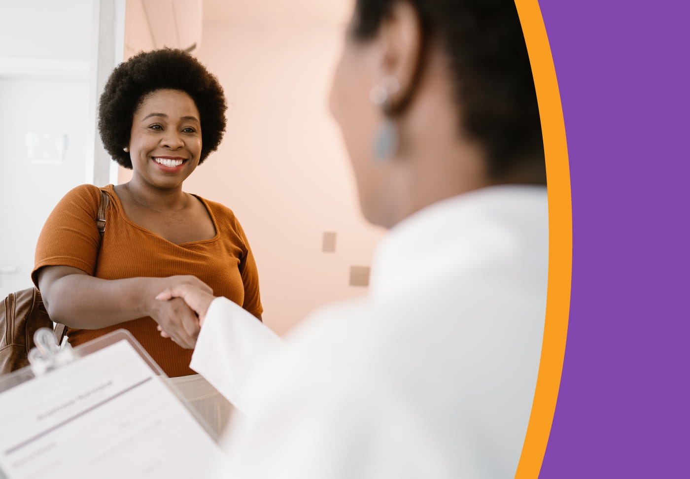 What to Expect from Obesity Treatment A smiling patient shakes hands with her healthcare provider.