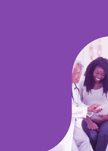 Healthcare provider shares information with a smiling mother-to-be