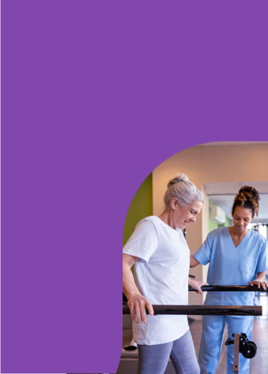 Physical therapist assists a patient on a treadmill