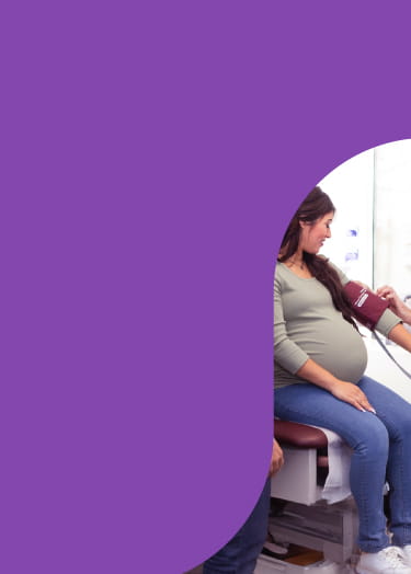 Pregnant woman with blood pressure cuff